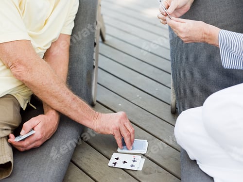Preview: People playing cards outdoors