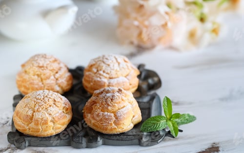 Preview: traditional choux pastry eclair dessert on a plate
