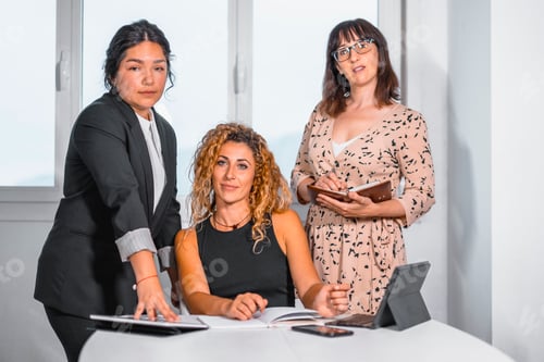 Preview: two young Caucasian girls and a young Latina in the office on the break