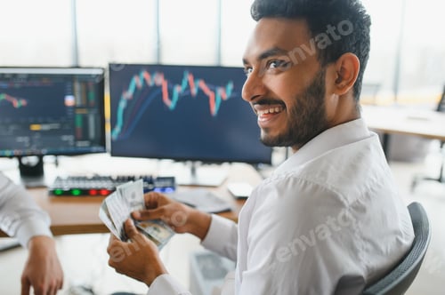 Preview: Portrait of a positive successful Indian or Arabian trader, stock market broker,
