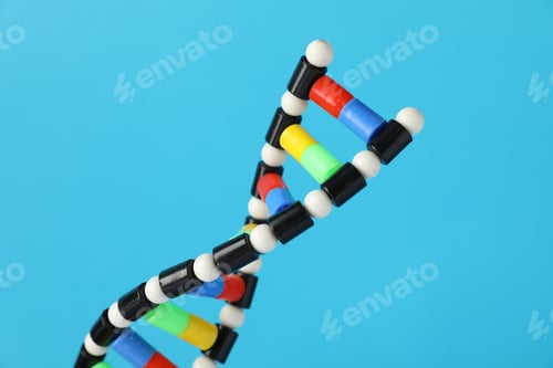 Preview: DNA structure model on light blue background, closeup