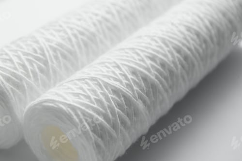 Preview: Cartridges for water treatment systems on white background.