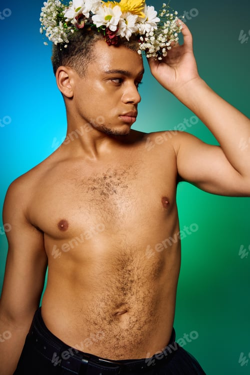 Preview: Young man with dyed hair showcasing beauty and confidence in a creative studio setting