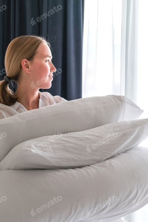 Preview: girl cleans the bedroom. Makes the bed after sleep. House cleaning, daily cleaning concept, cleaning