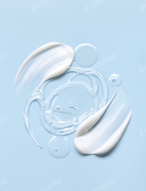 Preview: cosmetic cream smears, smooth and shiny texture, blue background