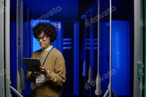 Preview: Woman using tablet pc in data center