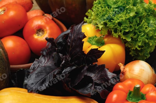 Preview: Fresh vegetables pile with salad and basil close up