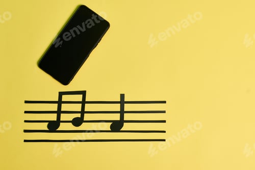 Preview: A phone and music notes on a yellow background