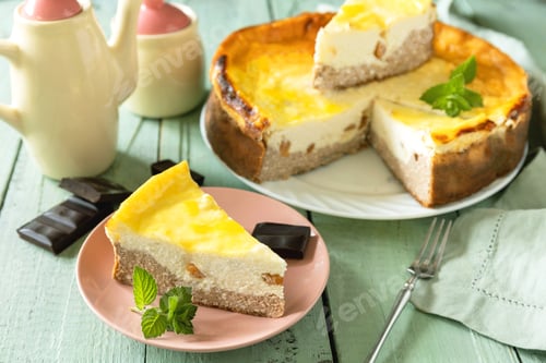 Preview: Delicious lemon cheesecake with tea set for dessert presentation.