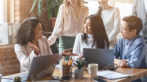 Preview: Professional afro woman sharing business ideas with colleagues