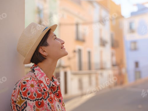 Preview: Woman strolls through colorful streets of Spanish coastal town