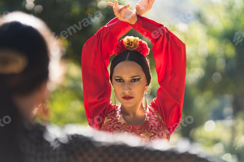 Preview: Focus on a flamenco dancer performing in front of other woman
