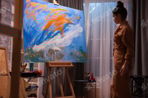 Preview: Artist checking painting