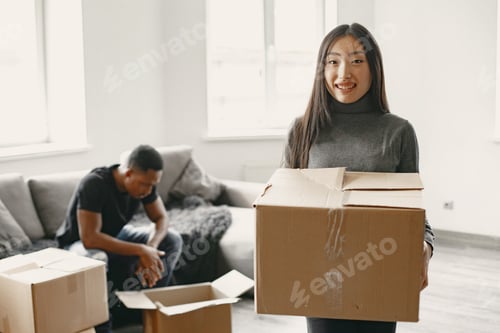 Preview: Couple unpacking boxes at their new home
