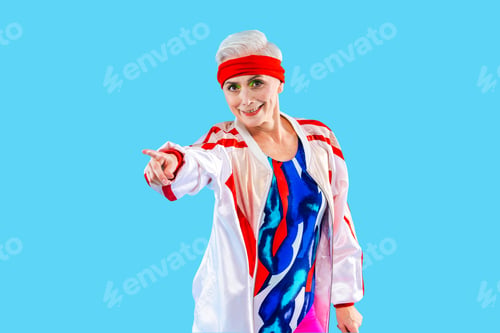 Preview: Happy and funny senior old woman on colorful background