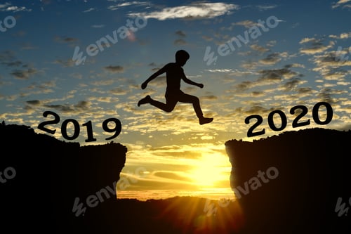 Preview: Silhouette of young man jump between 2019 and 2020 years, over the sunset and through gap of hill