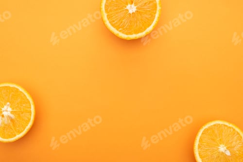 Preview: top view of juicy orange slices on colorful background
