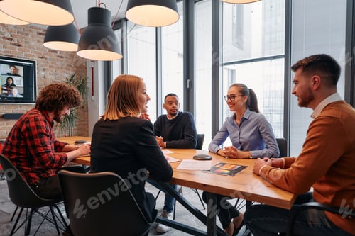 Preview: In the vibrant ambiance of a modern startup office, a diverse team of business professionals engage
