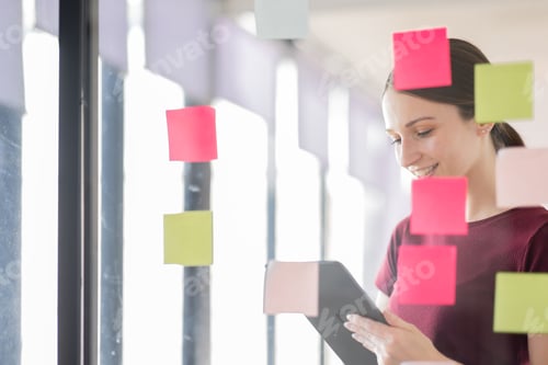Preview: Business woman meeting at office and use post it notes in glass wall to share idea. Brainstorming bu