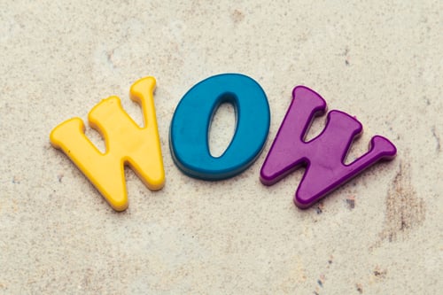 Preview: Word Wow written in colorful plastic letters close up shot