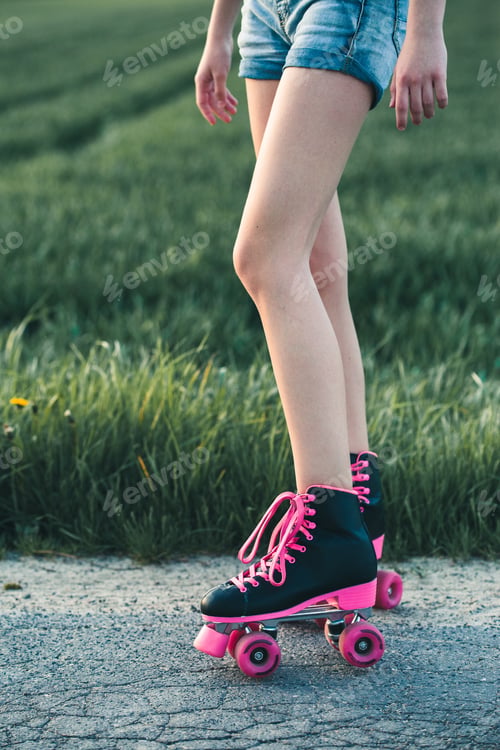 Preview: Teenage girl having fun rollerskating, spending time outdoors
