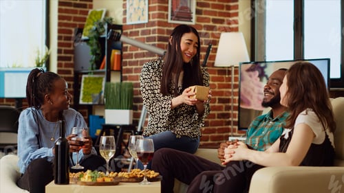 Preview: Guests surprising their friend with neatly packaged present in her living room