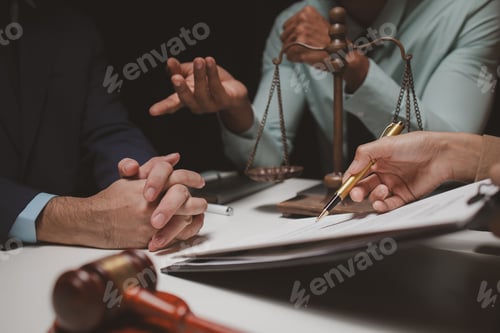 Preview: A group of lawyers is discussing contract documents that must be presented to a client, Lawyers brai
