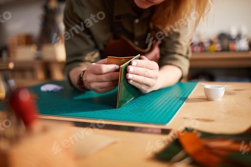 Preview: Unrecognizable Woman doing Leatherwork