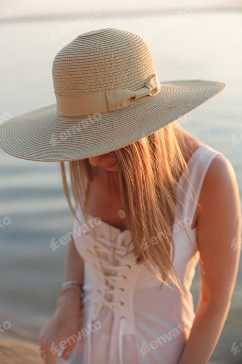 Preview: Summer Hat on woman walking on beach