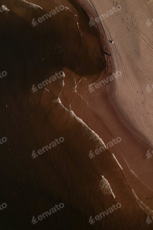 Preview: Drone aerial view of waves sea ocean coast. Beach and dunes dark calm sea waves nature landscape