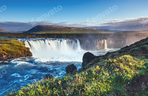 Preview: Godafoss waterfall at sunset. Fantastic landscape. Beautiful cumulus clouds