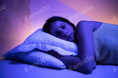 Preview: Adult woman, tossing and turning in her bed.