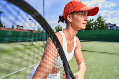 Preview: Confident sportswoman taking part in professional tennis match