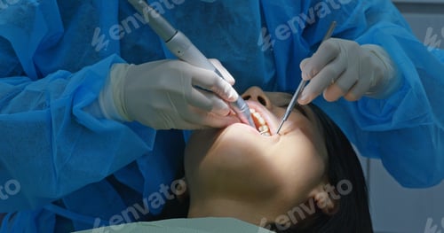 Preview: Woman under dental check up in clinic