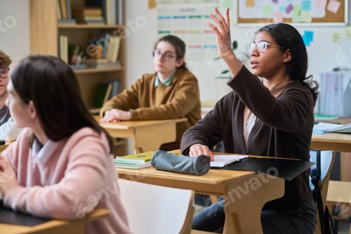Preview: Teenage Students Raise Hand in Classroom Discussion