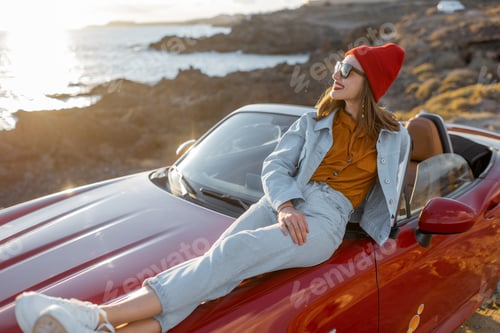Preview: Woman traveling by car on the rocky coastline