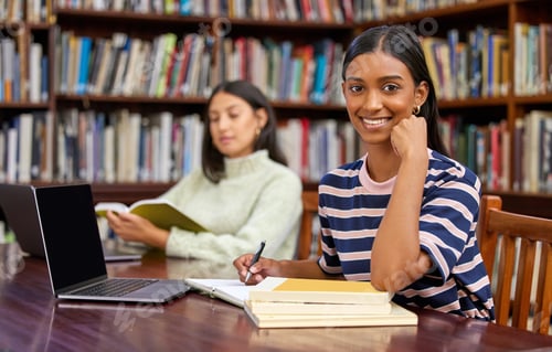 Preview: Great libraries build communities. Shot of two student studying in a library.