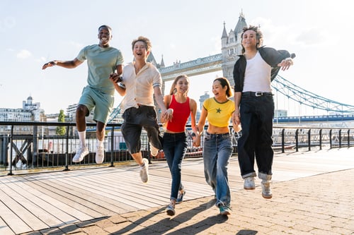 Preview: Multiracial group of happy young friends bonding in London