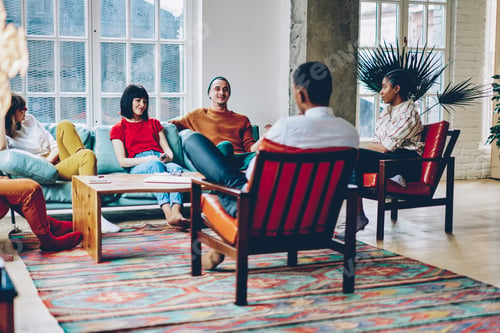 Preview: Diverse friends sitting around table