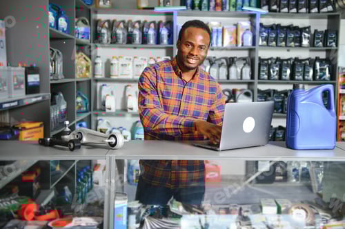 Preview: Smiling african Salesman Auto Parts Store