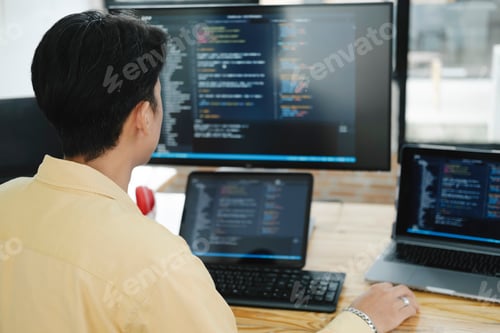 Preview: IT Programmer Starts Working on Desktop Computer.