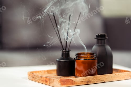 Preview: Aromatic reed freshener and candle on table in room