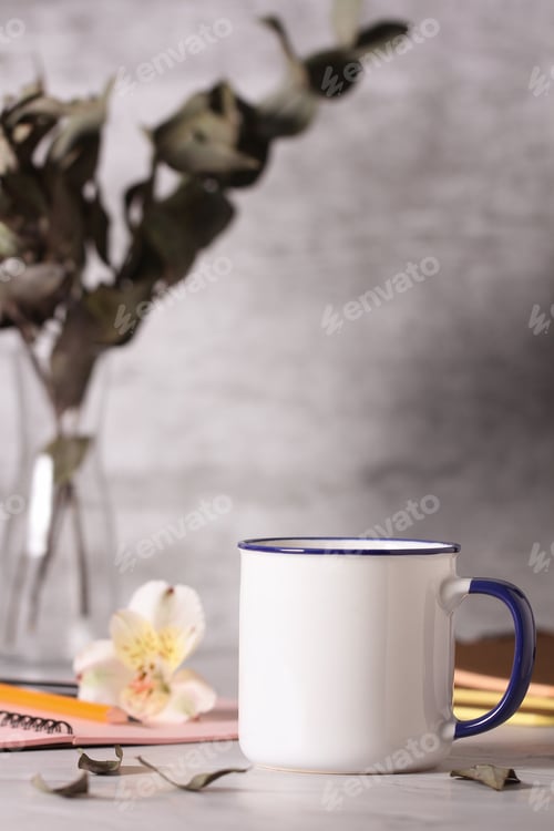 Preview: A Mug A Notebook A Pencil Lie On The Desktop