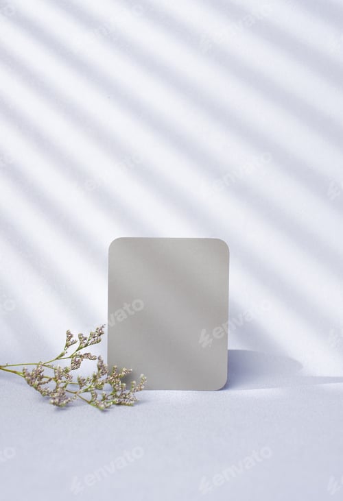 Preview: blank grey poster paper card with flower and window sunlight on pastel violet background
