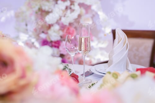 Preview: Bride and groom champagne glasses at a wedding reception