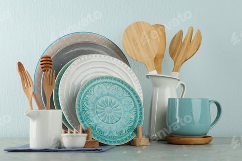 Preview: Set of kitchenware on grey marble table near light wall. Modern interior design