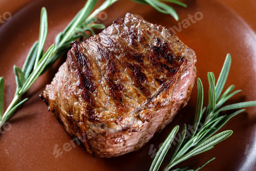 Preview: Grilled Steak with Fresh Rosemary Garnish on Plate