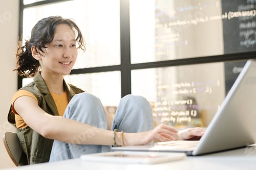 Preview: Student working on laptop in the classroom