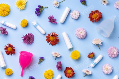 Preview: Menstrual cup and tampons on floral pattern background