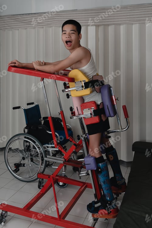 Preview: Body of disabled kid practice standing on a device to strengthen legs muscles